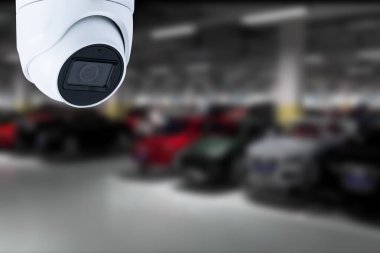 CCTV Camera Operating in car park building. Copy space