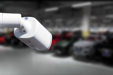 CCTV Camera Operating in car park building. Copy space
