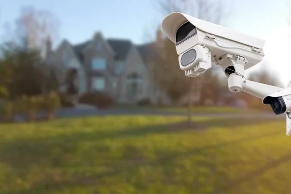 CCTV Camera with house in background. Close-up