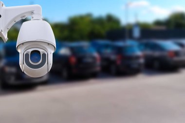 Closeup outdoor CCTV camera at a car parking lot