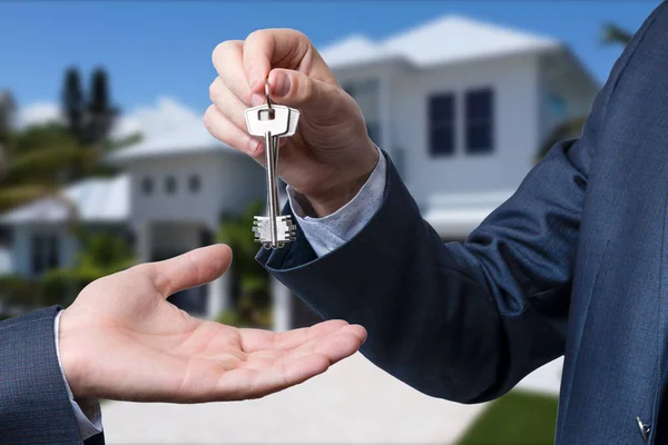 stock image The real estate agent gives the keys to the meeting after the signing of the lease