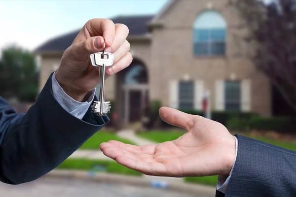 stock image Handing the home keys between realtor and new owner. sale concept