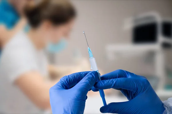 stock image close up of male doctor holding syringe with injection