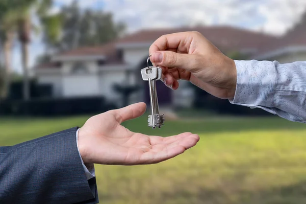 stock image Handing Over the House Keys in Front of a Beautiful New Home