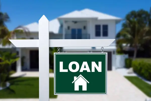 LOAN sign against a house. Close-up