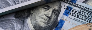 high-definition close-up of benjamin franklins face from the hundred-dollar bill. clipart