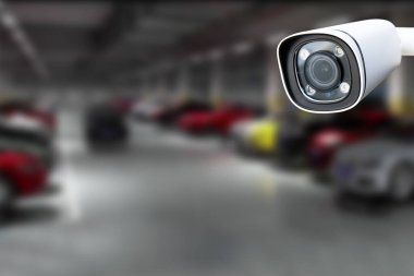 CCTV Camera Operating in car park building. Copy space