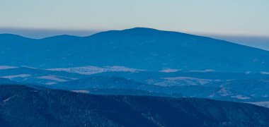 Pilsko in Oravske Beskydy mountains from Velky Choc hill in Chocske vrchy mountains in Slovakia during beautiful autumn day