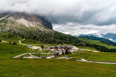 Passo Sella in the Dolomites during cloudy summer day clipart