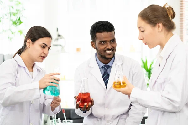 Portraits of a diversity of scientists smile in a research laboratory. Group of chemistry students working on hemp plant and Marijuana research in the lab. Concept of alternative herbal medicine, CBD