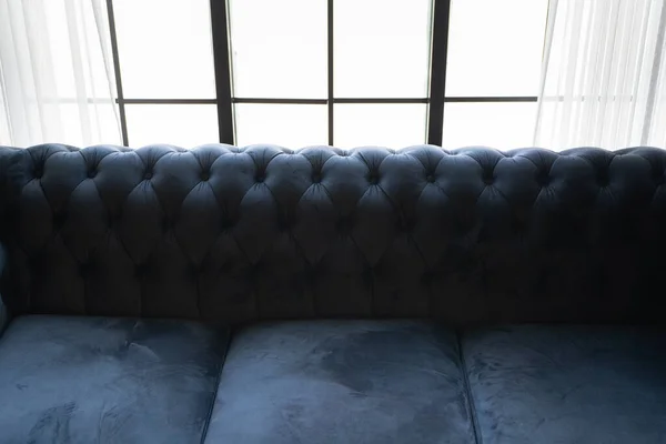 Sofa Chester in an interior. seat leather sofa. Selective focus.