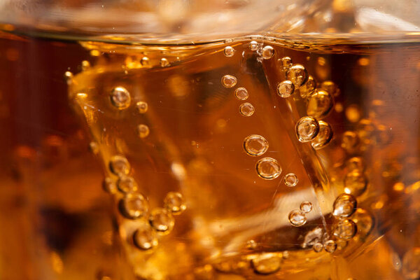 Cola with Ice. Food background ,Cola close-up ,design element. Beer bubbles macro,Ice, Bubble, Backgrounds, Ice Cube. Refreshing cola flavored soda with carbonated 