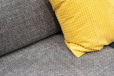 a part of pillows on sofa in living room. close up home interior concept soft pillow in bedroom. home sweet home interior ideas
