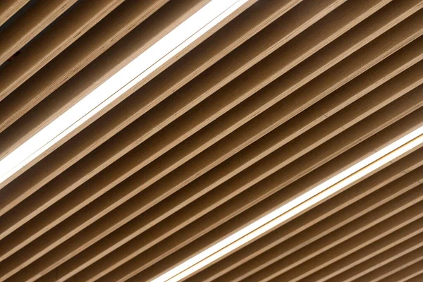ceiling with light wooden design. wooden plank ceiling, decorate with light.