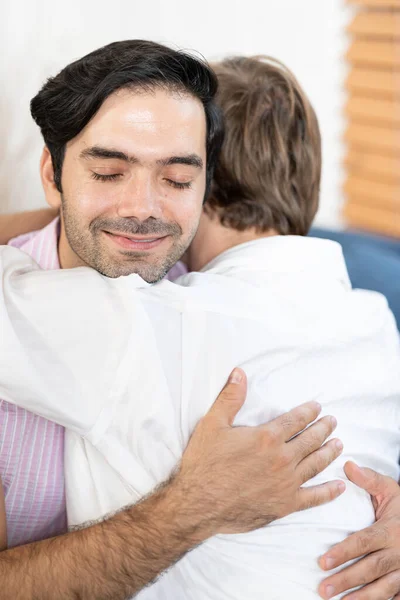 Gay Couple Sit Together Sofa Home Boyfriends Hugging Embracing Each — Stock Photo, Image