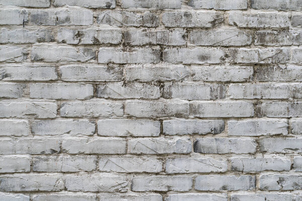 Texture, brick, wall, it can be used as a background. Brick texture with scratches and cracks. Abstract old white brick wall textured background.