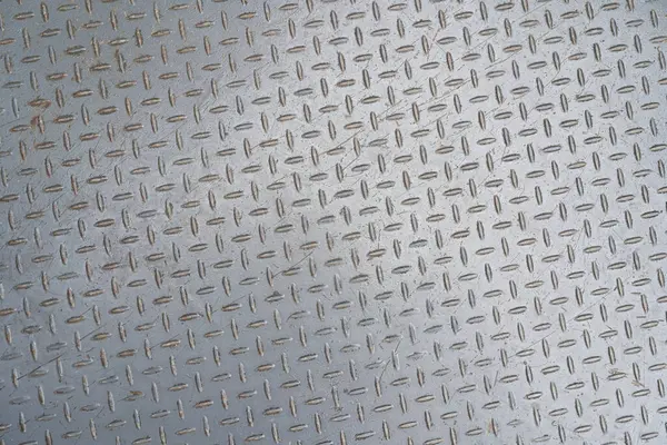 Metal floor plate with diamond pattern. Metal background or steel texture abstract.