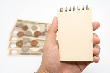 Boş not defteri ve Japon parasıyla Tayland pasaportu. Tatil, planlama bütçesi. seyahat planı konsepti.