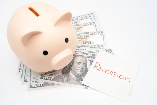 stock image Hand writing Recession Warning on paper note with piggy bank. Global economic crisis. Recession business and stock crisis concept.