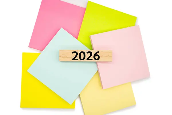 stock image 2026 text wooden block on colorful sticky note. 2026 new year idea concept.