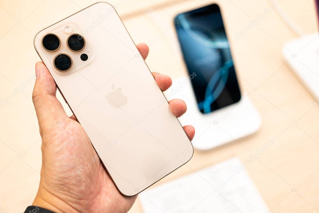 Bangkok Thailand SEP 20 2024: Apple launch new smartphone iPhone 16 Pro max displayed in a Store. Hand holding iPhone 16 pro max and showing the back of iPhone.