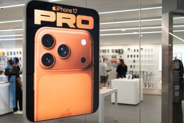 Vibrant display of the new iPhone 17 Pro in a retail store.