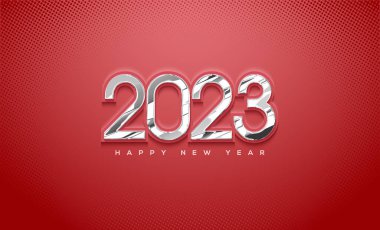 Kırmızı arka planda cam figürlerle 2023 yılınız kutlu olsun.