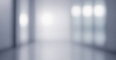 Yumuşak ışıklandırması ve cam bölmeleri olan modern bir ofisin bulanık görüntüsü.