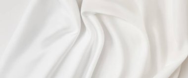 Temiz ve minimalist tarzda arkaplan fotoğrafları için kaliteli fotoğraflar. Yumuşak, akışkan beyaz kumaş, kıvrımları ve kıvrımları yumuşak..
