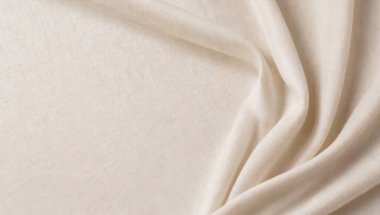 Temiz ve minimalist tarzda arkaplan fotoğrafları için kaliteli fotoğraflar. Sakin ve huzurlu altın rengi kumaş akışı.