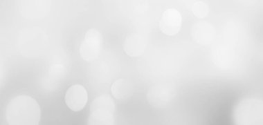 Hafif daireler, sakin grimsi bir tonda hafifçe süzülür. Parlak ve parlak renklerle yumuşak detaylarla modern bulanık bokeh arkaplan.