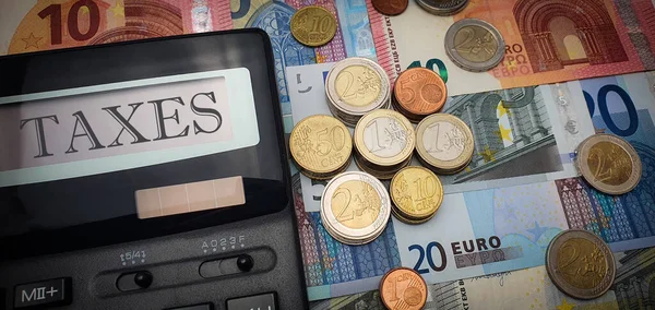 Calculator Word Taxes Screen Background Euro Bills Coins Tax Increase — Stock Photo, Image