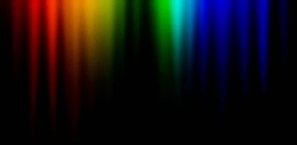 Dark background in rainbow colors. Bright red orange green blue unique blurred grainy background for website banner. Desktop design. A large wide template, pattern. Gradient, ombre, blur. Colorful mix