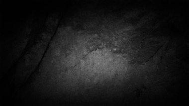 4K çözünürlüklü koyu ve karamsar siyah bir taş yapısı var. İnce eğimli. Atmosferik arkaplan, duvar kağıtları veya tasarım elementleri oluşturmak için ideal