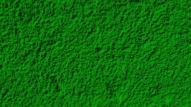 Çarpıcı soyut bir arka plan, koyu, desenli yeşil bir yüzeye sahip. Kumlu doku duvar kağıtları, dijital tasarımlar ve yaratıcı projeler için cazibesini arttırır.