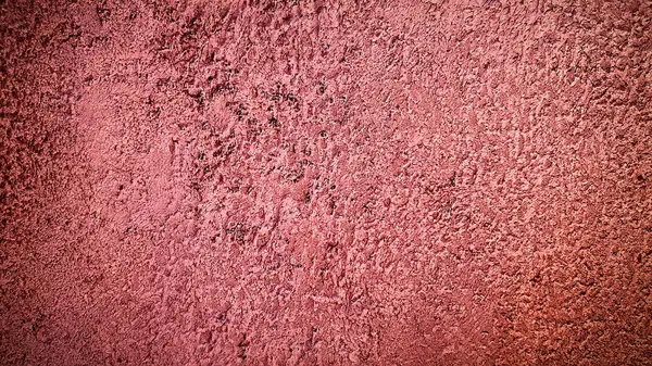 Yumuşak ve yıpranmış görünümlü, pembe desenli beton bir yüzey. Yaratıcı, modern ve sanatsal tasarımlar için mükemmel, cesur ama ince bir görsel etki ekleyerek