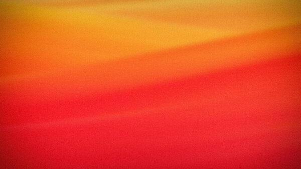 A warm gradient with smooth transitions from yellow to orange and red, enriched with a grainy texture, perfect for vibrant digital backgrounds and wallpapers