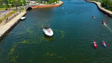 Aerial view of the boat on Moltawa behind the footbridge in Gdansk. High quality 4k footage