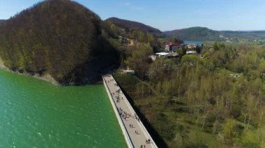 Tourists On The Water Dam On Solina Lake Bieszczady Mountains Aerial View Poland. High quality 4k footage