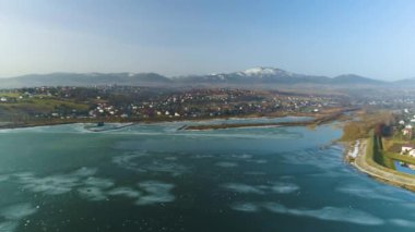 Frozen Lake And Panorama Of Zywiec Aerial View. High quality 4k footage
