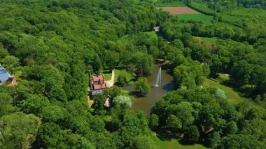 Park Pond With Fountain Kamieniec Zabkowicki Fontanna Aerial View Poland. High quality 4k footage