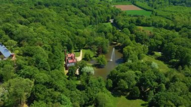 Park Pond With Fountain Kamieniec Zabkowicki Fontanna Aerial View Poland. High quality 4k footage