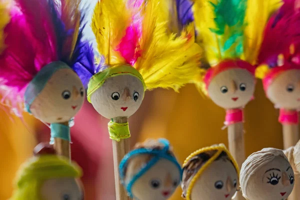 Details of the decoration of the end of the pencil With knick-knacks resembling dolls with various shapes and decorations, the wooden craft of rik-rok