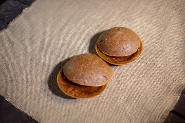 Round organic palm sugar traditionally processed by rural communities in Indonesia, photographed in the kitchen of one of the villagers