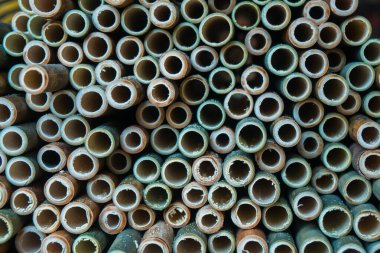 A very large pile of small bamboo, which will later be made into various crafts such as children's toys, straws, flutes, and others, the production process is done manually by local craftsmen