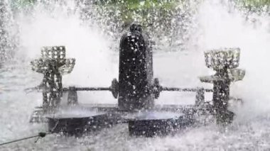 Waterwheel in red tilapia fish farming pond. Waterwheel system to circulate water and oxygen in artificial ponds, so that fish are healthier and the water remains clear
