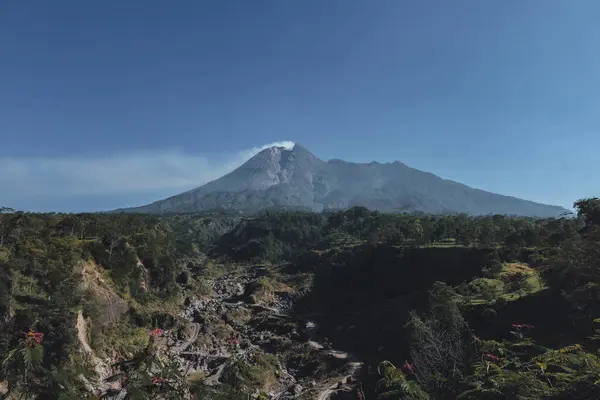 stock image Panorama of Mount Merapi with beautiful views in the morning in summer. Active volcano landscape in detail with forest and ravine in front