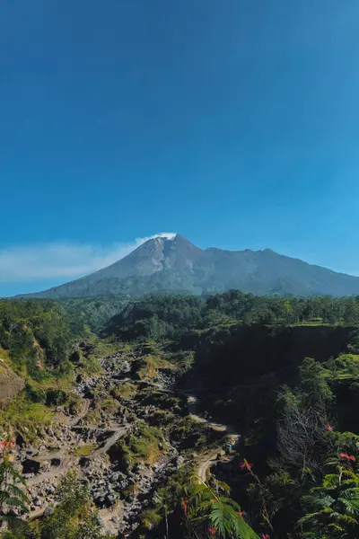 stock image Panorama of Mount Merapi with beautiful views in the morning in summer. Active volcano landscape in detail with forest and ravine in front