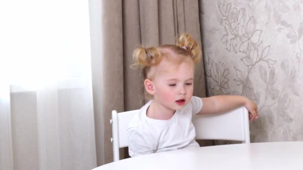 Little Girl White Shirt Sits Table Plays Green Apple — Stock Video