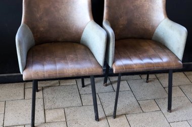 Chair and table in a cafe in a city park near the sea.